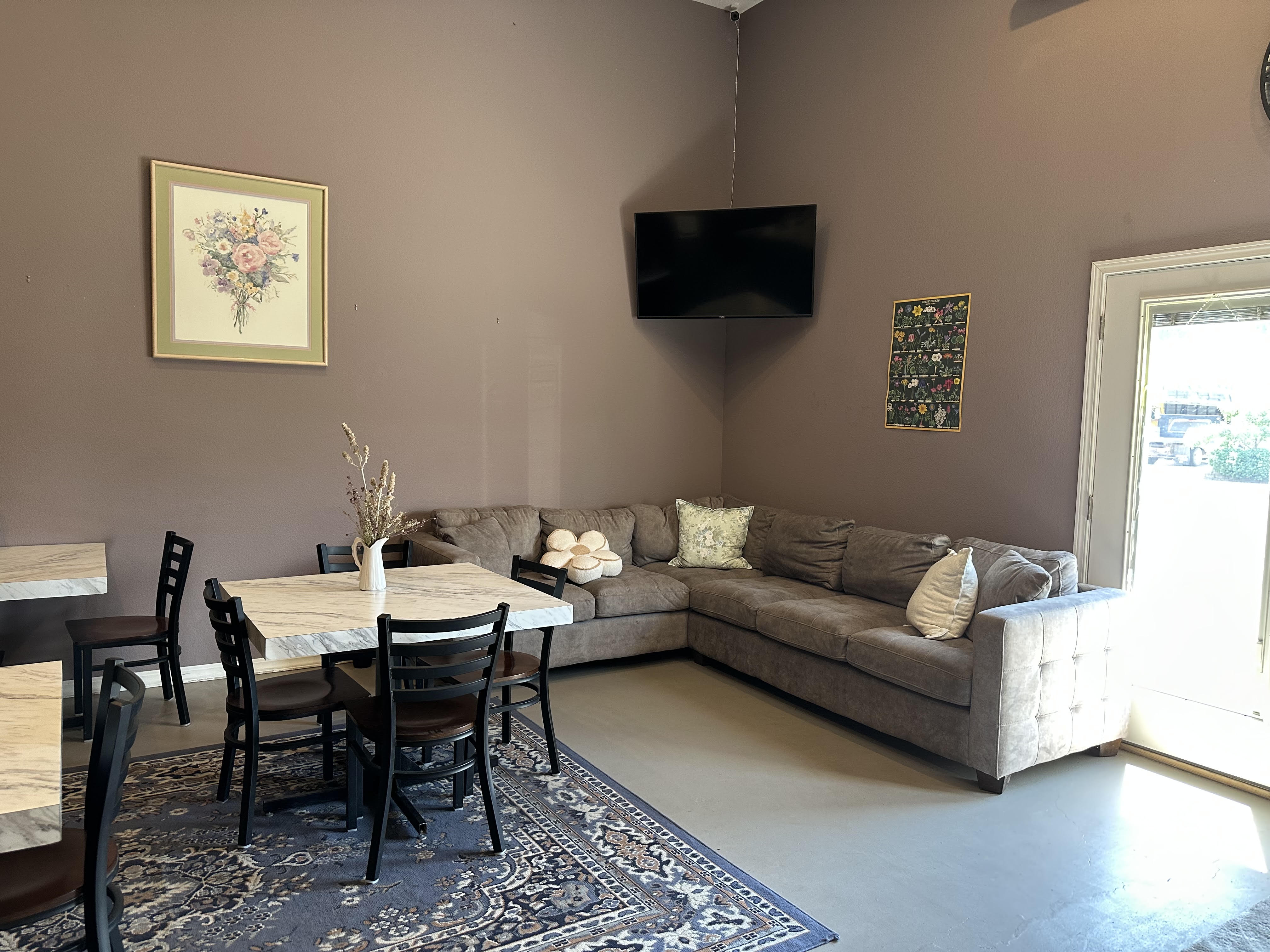 Kind Brew Coffee offers a variety of tables and comfortable chairs. Kind Brew Coffee offers a variety of tables and comfortable chairs.
