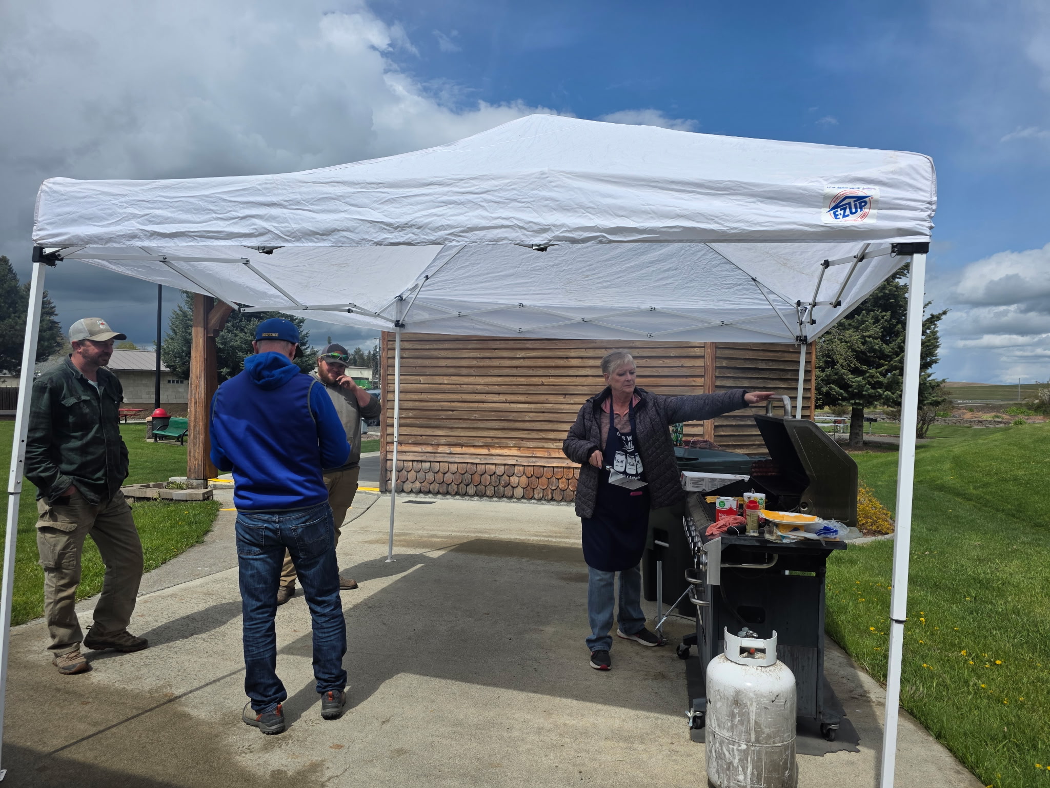aCity Clerk Rhonda Schmidt manned the grill during the Arbor Day celebration. City Clerk Rhonda Schmidt manned the grill during the Arbor Day celebration.